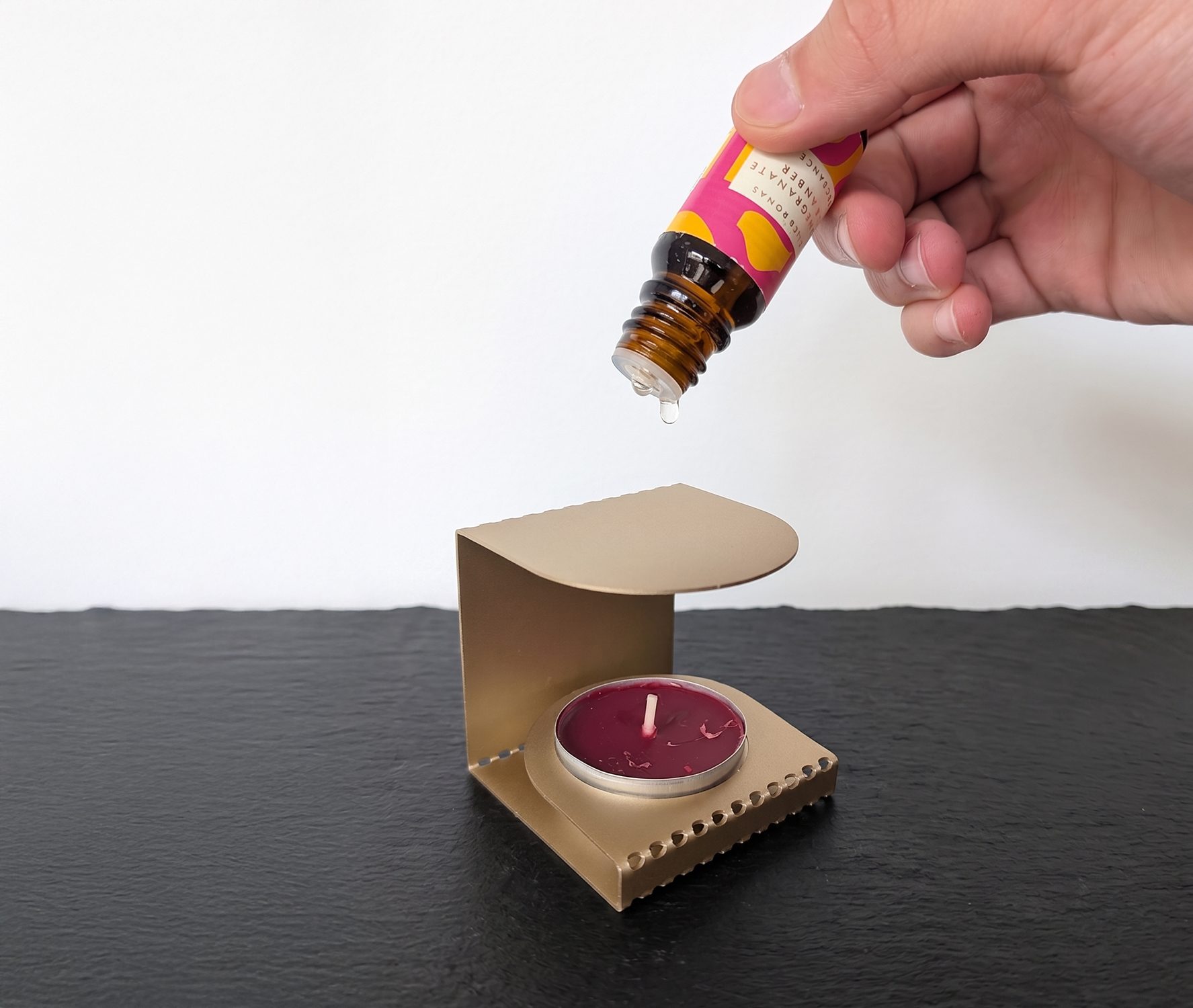 In use — oil on top, flame below